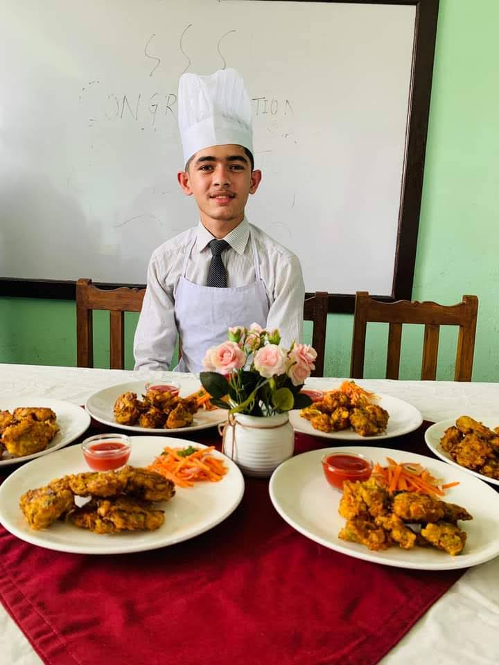 Chef Binaya Neupane preparing food